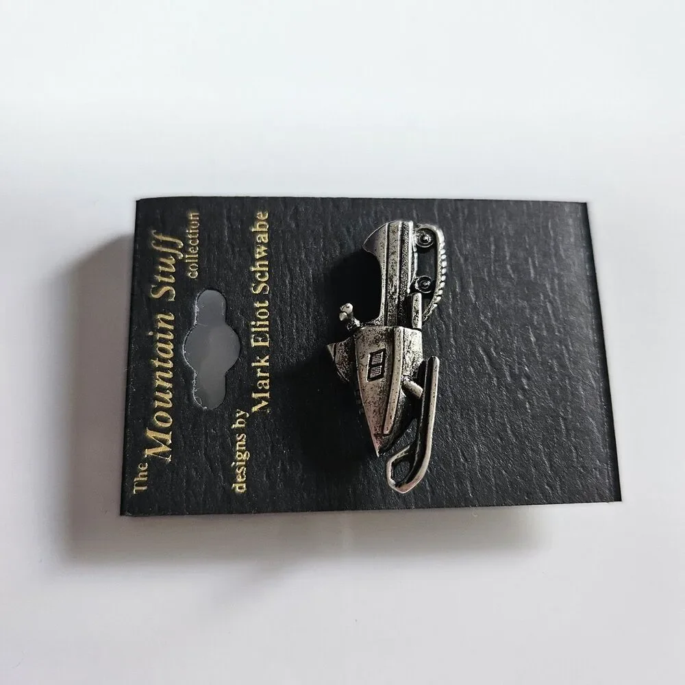 The Mountain Stuff Mark Eliot Schwabe Snowmobile Pin Silver Tone